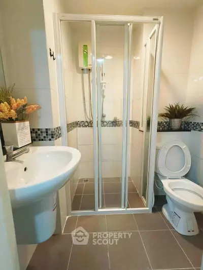 Modern bathroom with shower enclosure and stylish decor