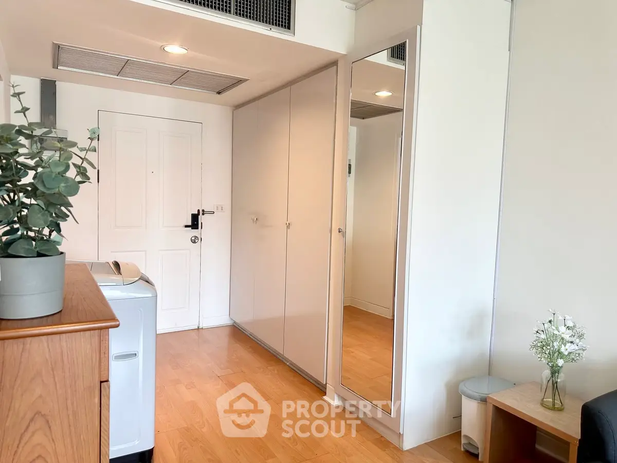 Modern apartment entrance with sleek storage and stylish decor