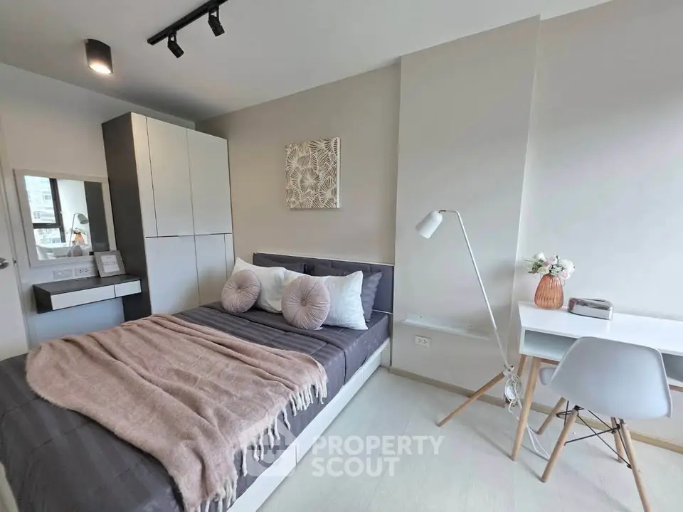 Modern bedroom with stylish decor and cozy workspace