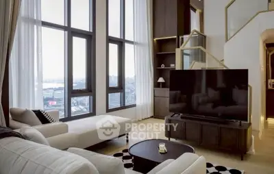 Luxurious living room with floor-to-ceiling windows and stunning city view