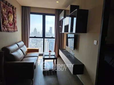 Modern living room with stunning city view, featuring sleek furniture and elegant decor.