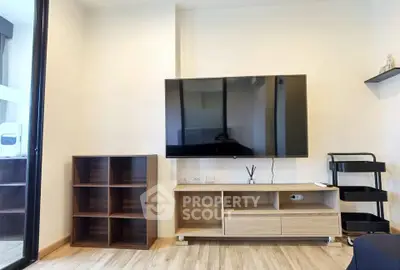 Modern living room with sleek TV setup and stylish wooden furniture