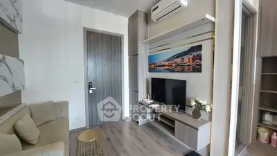 Modern living room with stylish decor and wall-mounted TV