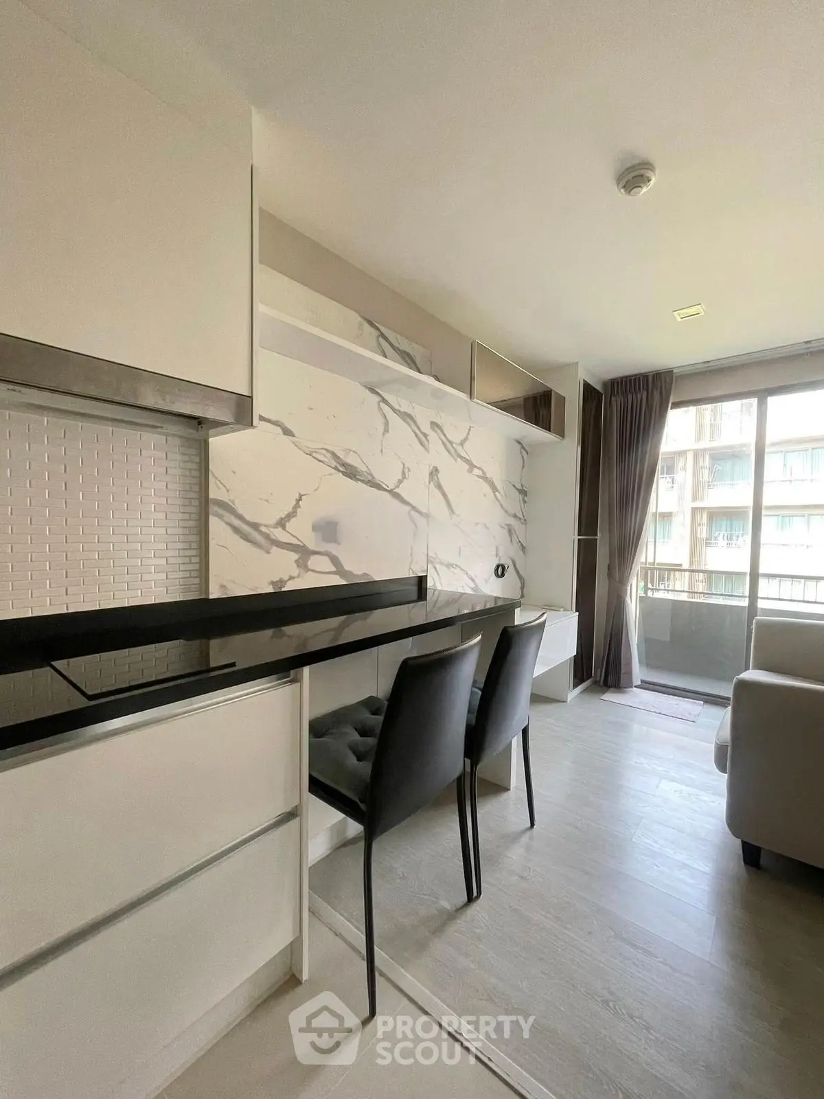 Modern open-layout kitchen with sleek design and natural light