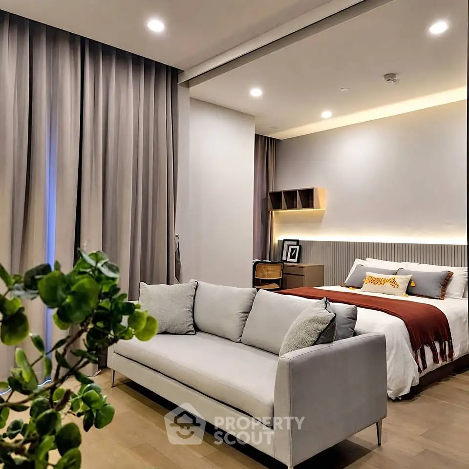 Luxurious modern bedroom with stylish decor and cozy seating area, perfect for relaxation and comfort.
