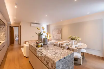Luxurious open-plan living and dining area with elegant decor and modern furnishings.