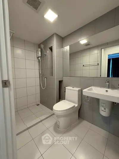 Modern bathroom with sleek tiles and contemporary fixtures