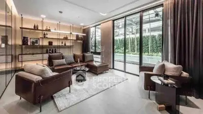 Luxurious living room with modern furniture and pool view, featuring elegant decor and floor-to-ceiling windows.