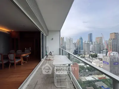 Spacious balcony with stunning city view, perfect for relaxation and entertainment.