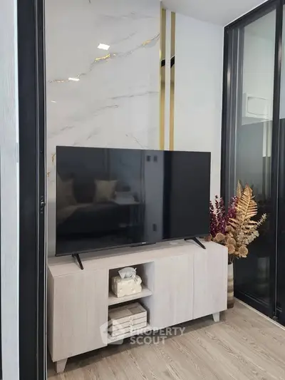 Modern living room with sleek TV setup and elegant decor