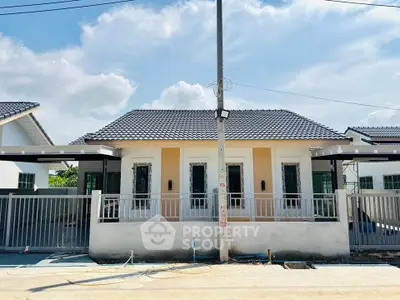 Charming single-story house with modern design and spacious front yard, perfect for family living.