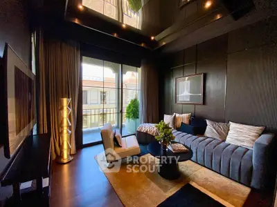 Luxurious living room with modern decor and balcony view, featuring elegant furniture and ambient lighting.