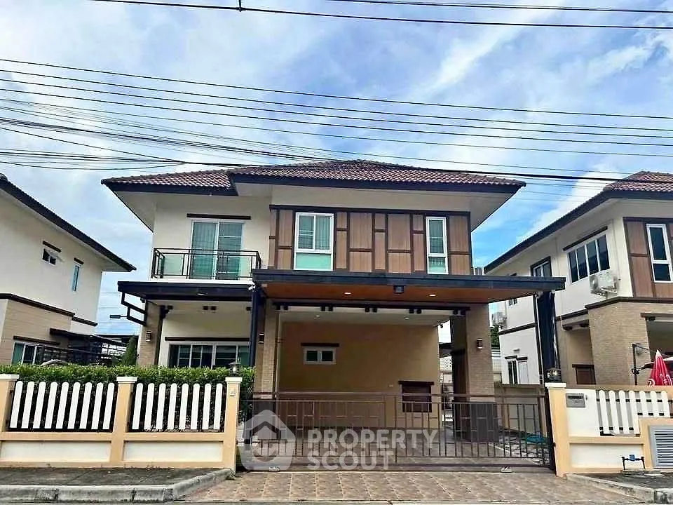 Charming two-story house with modern design and spacious driveway in a serene neighborhood.