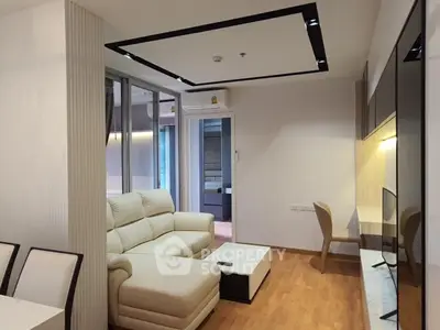 Modern living room with stylish furniture and open balcony view