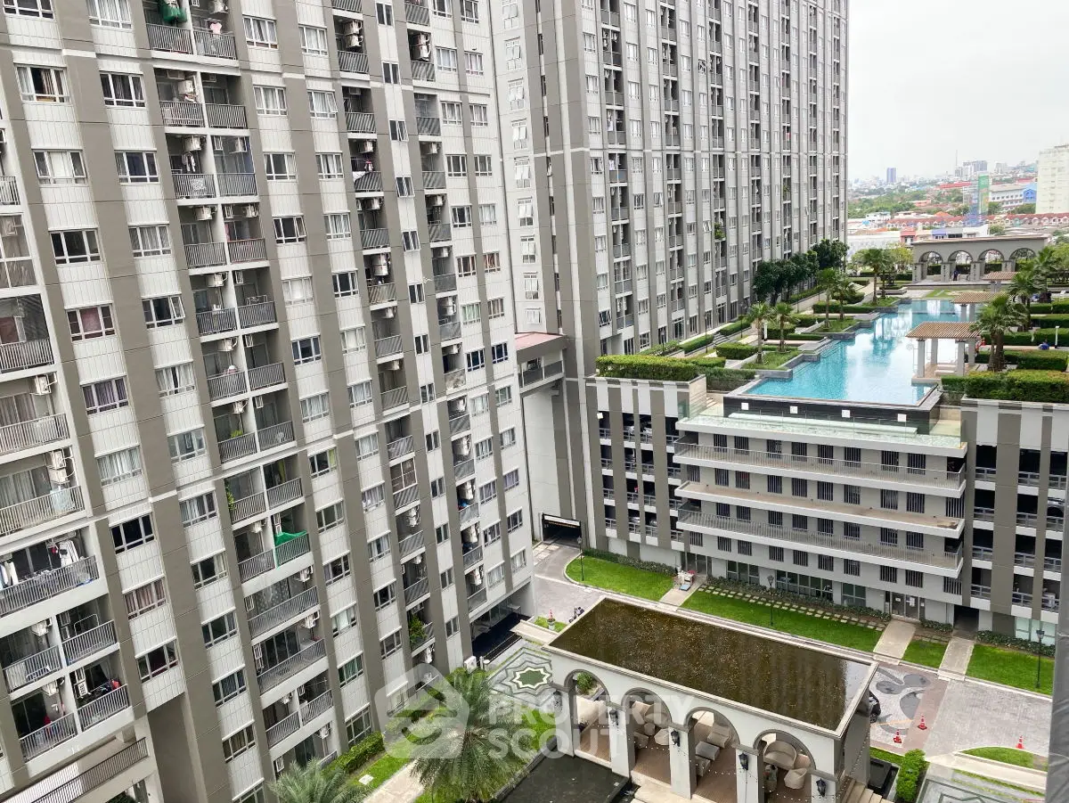 Luxurious high-rise apartment complex with stunning pool and lush greenery