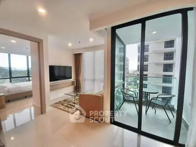 Modern apartment with open living room and balcony view