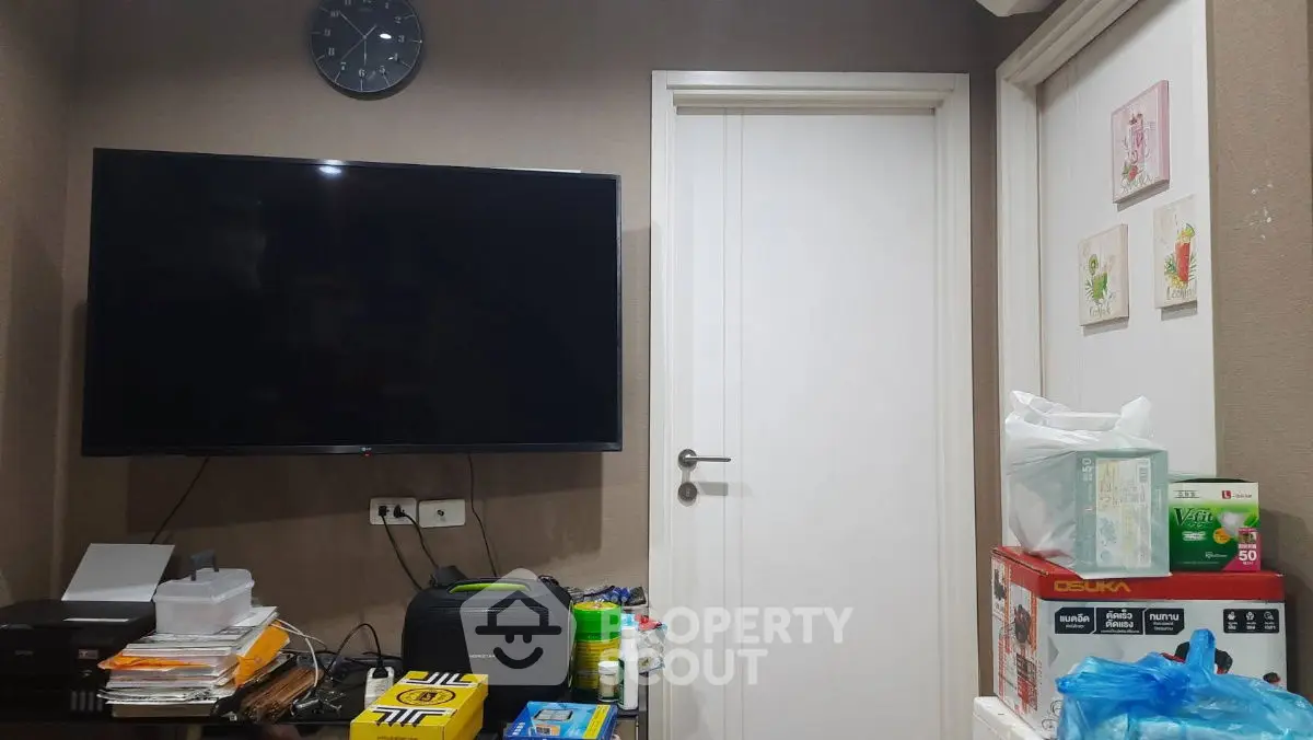 Cozy living room with wall-mounted TV and modern decor