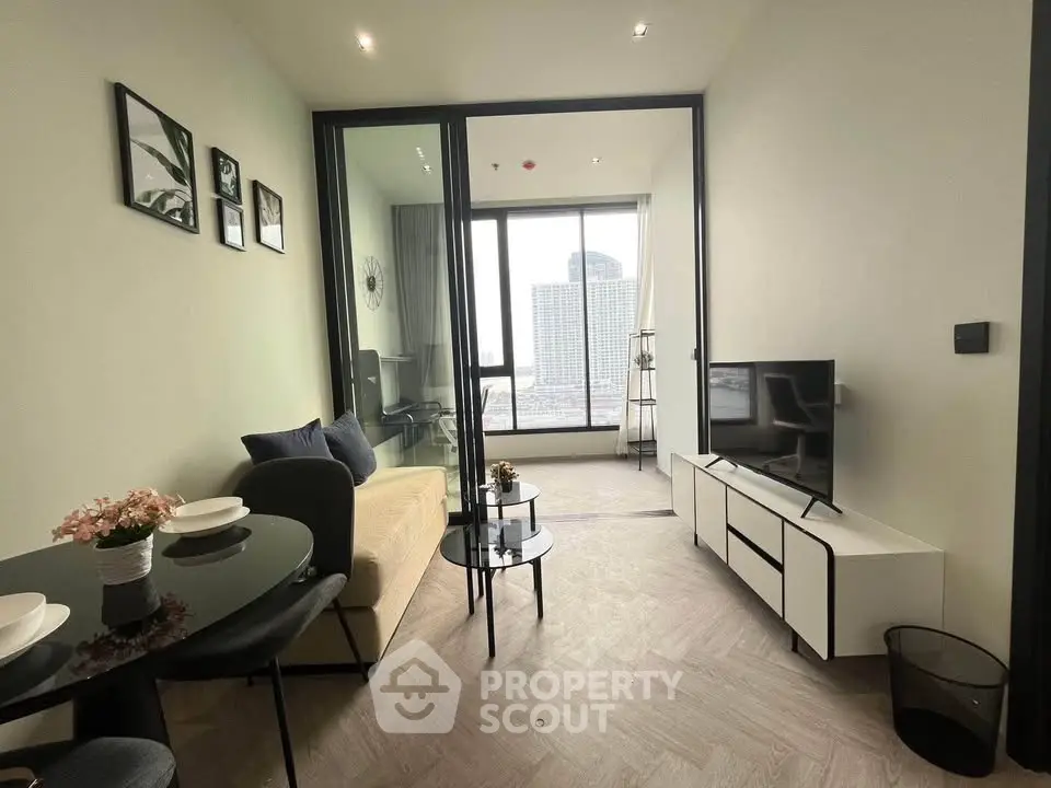 Modern living room with city view, sleek furniture, and stylish decor