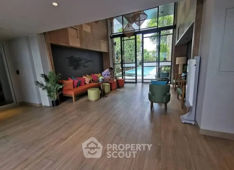 Spacious modern living room with pool view and stylish decor