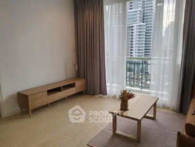 Modern living room with large window and city view, featuring minimalist wooden furniture.