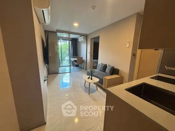 Modern apartment interior with open layout and balcony view