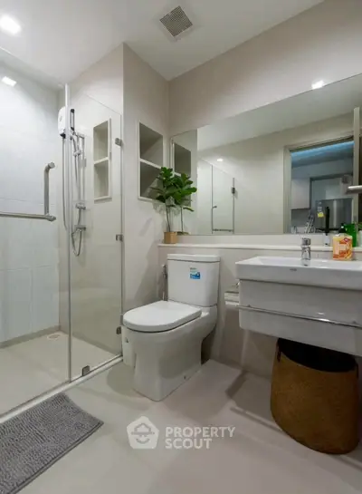 Modern bathroom with glass shower and sleek fixtures