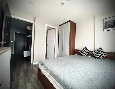 Modern bedroom with stylish decor and wooden flooring