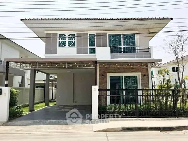 Modern two-story house with carport and stylish facade in suburban neighborhood.