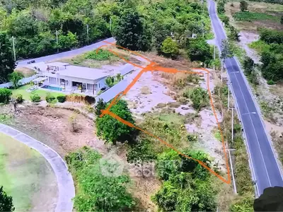 Aerial view of a rural property with outlined land area and surrounding roads.