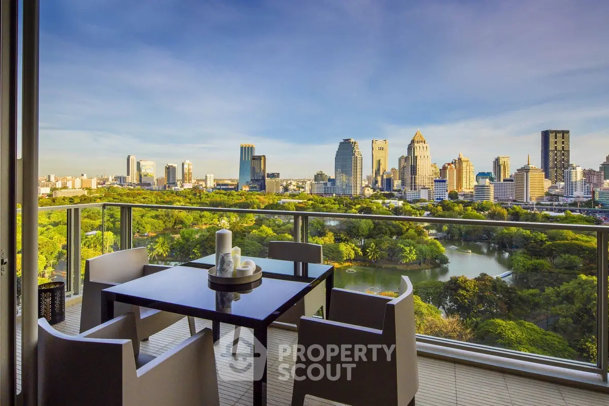 Luxurious balcony with stunning city skyline and park view, perfect for relaxation and entertaining.
