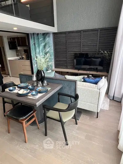 Modern open-plan living room with stylish dining area and sleek kitchen
