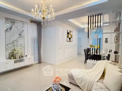 Luxurious living room with elegant chandeliers and modern decor