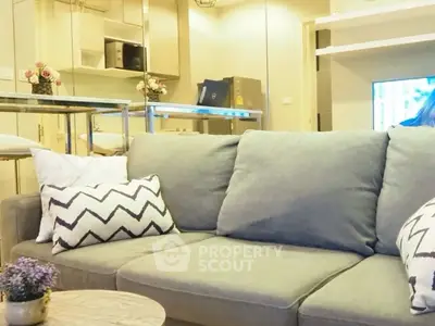 Modern living room with stylish gray sofa and chic decor