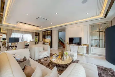 Luxurious living room with elegant decor and plush seating in a modern home.