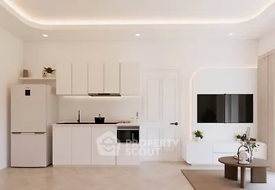 Modern minimalist kitchen and living area with sleek white cabinetry and stylish decor.
