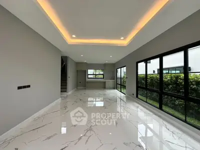 Spacious modern living room with marble flooring and large windows