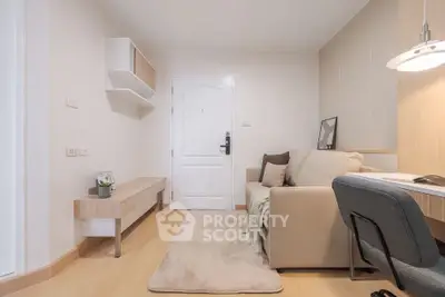 Cozy living room with modern decor and comfortable seating in a stylish apartment.