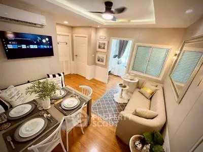 Charming living room with dining area, cozy decor, and modern amenities in a stylish apartment.