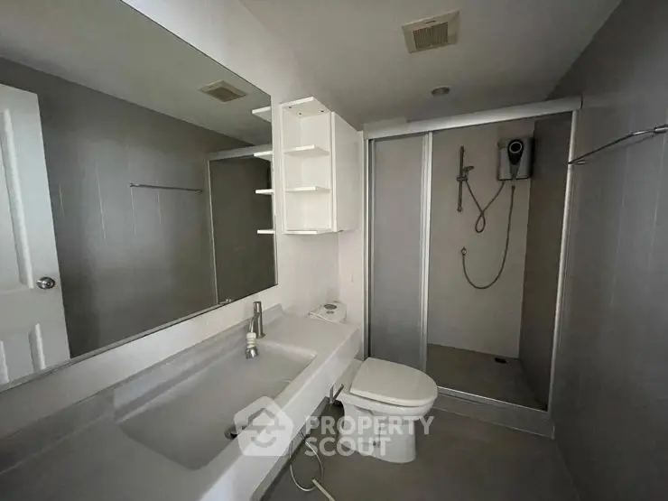 Modern bathroom with sleek design and spacious shower area