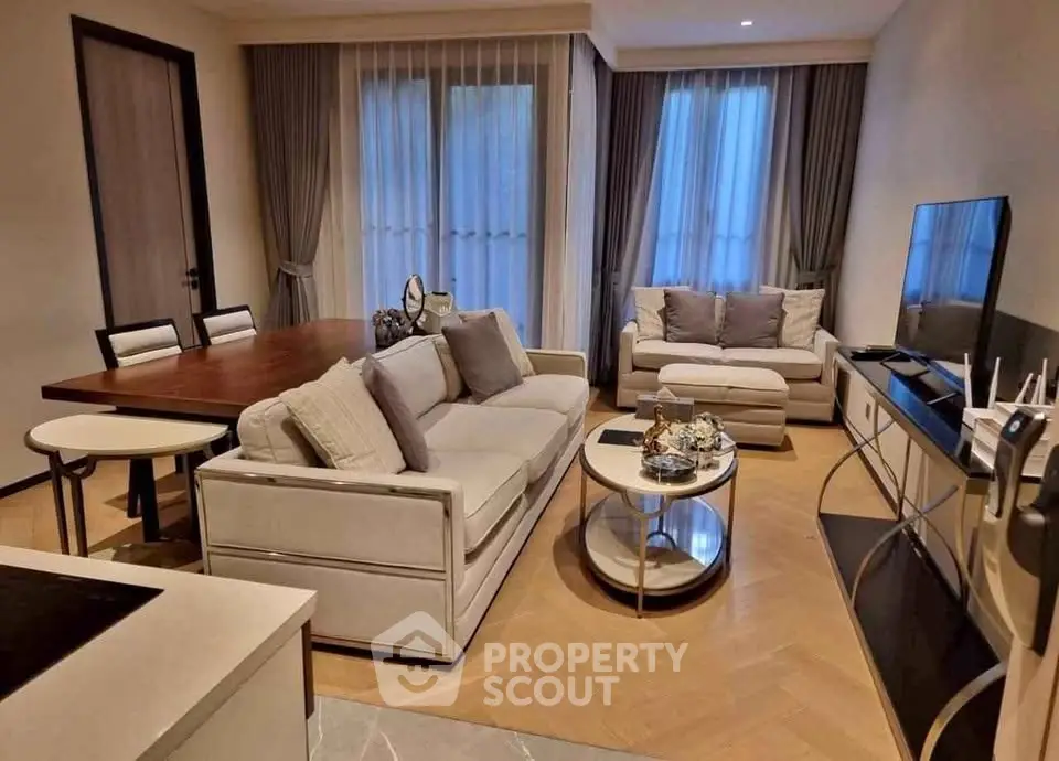 Elegant living room with modern furniture and natural light, perfect for relaxation and entertainment.