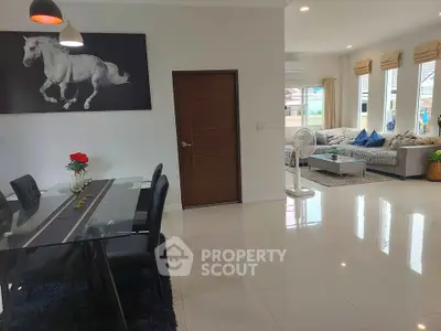 Spacious modern living room with elegant dining area and stylish decor