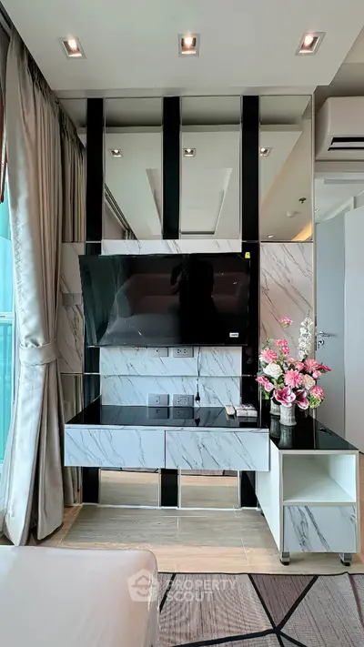 Modern living room with sleek TV setup and elegant decor