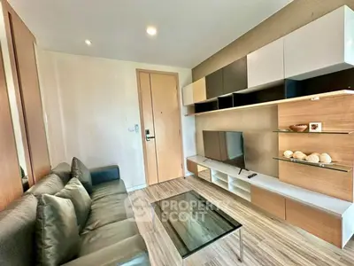 Modern living room with sleek furniture and built-in shelving