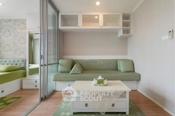 Modern living room with green accents and sliding glass doors