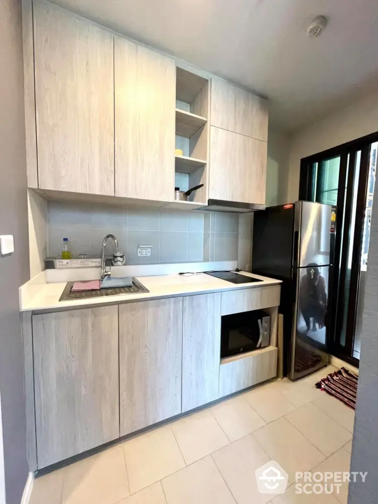 Modern kitchen with sleek cabinetry and stainless steel appliances