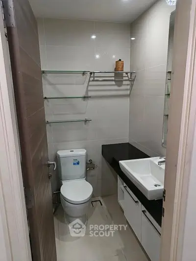 Modern bathroom with sleek fixtures and ample storage space