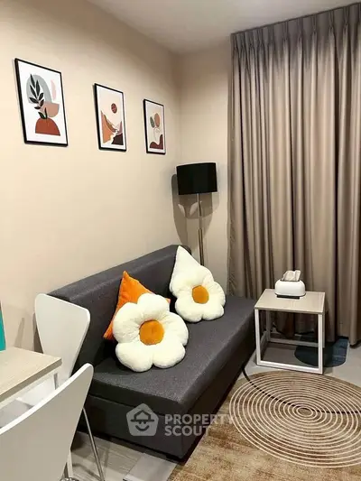 Cozy living room with stylish decor and flower-shaped cushions on a modern sofa.