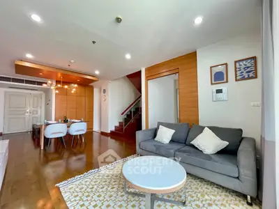 Spacious modern living room with stylish decor and open dining area