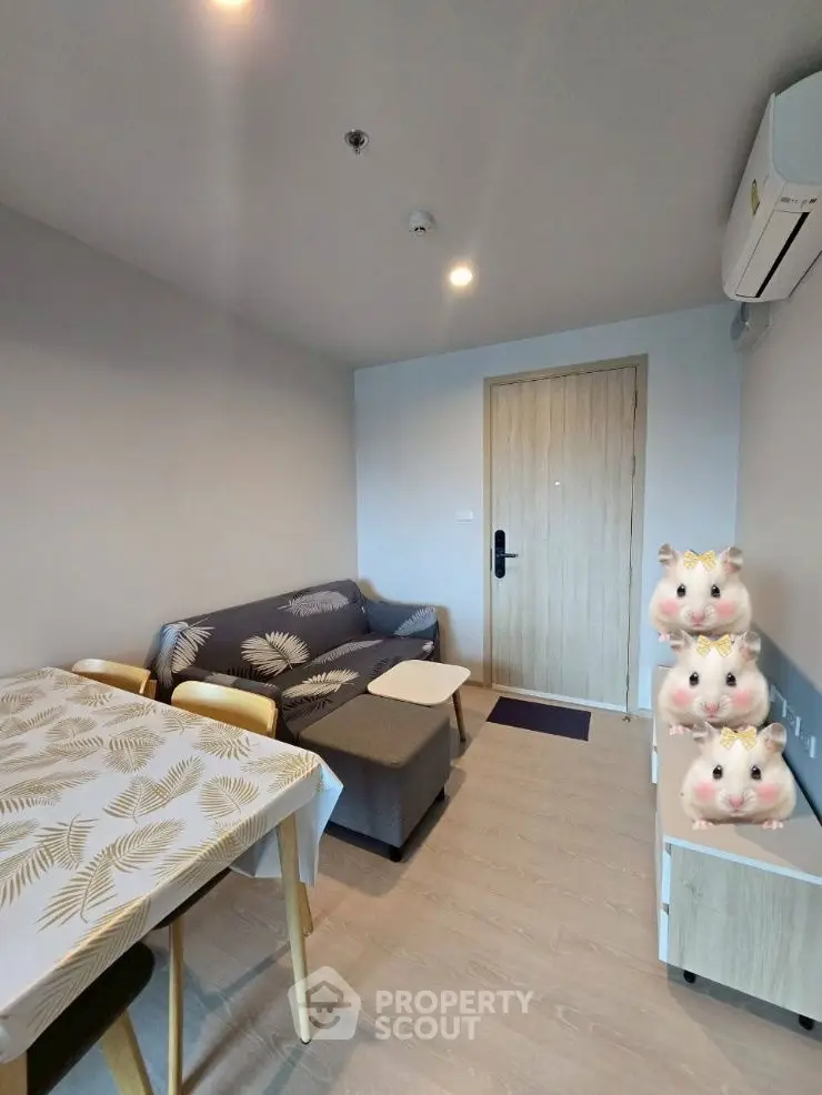 Cozy living room with modern decor and dining area, perfect for relaxation.