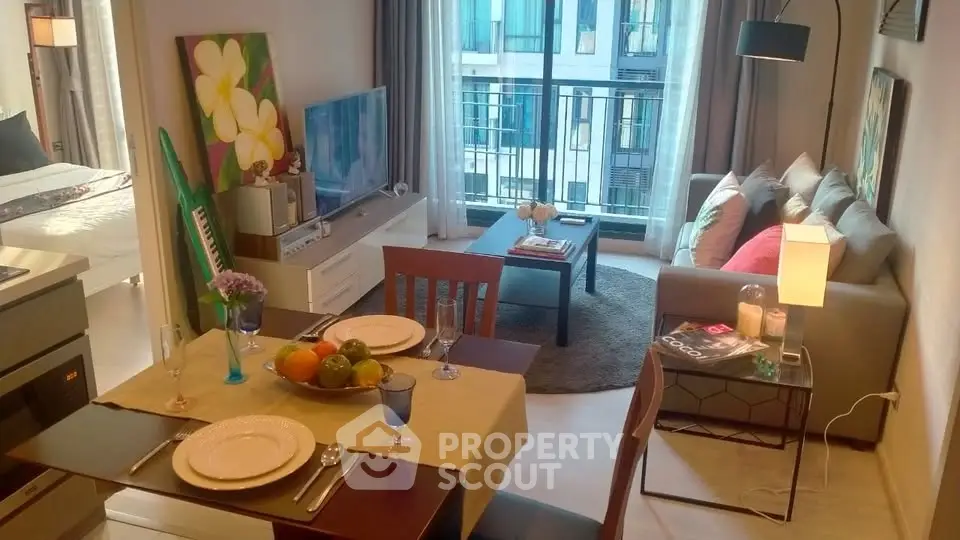 Chic modern living room with cozy seating and dining area, perfect for urban living.